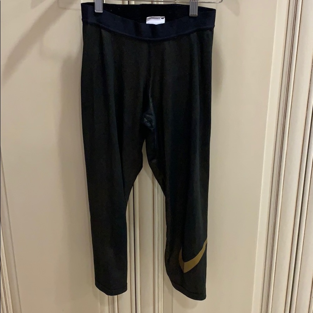 Nike black and gold sparkle legging
